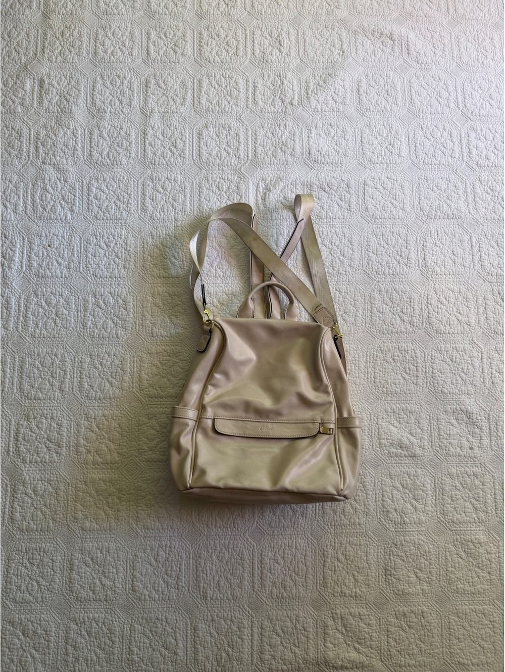 Beige Leather Backpack with Adjustable Straps and Front Flap